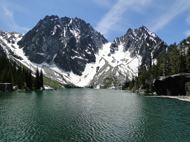 Colchuck Lake - Alpine Lakes Wilderness, Cascade Range. Set in a granite bathtub beneath spiraling peaks dabbed with shimmering strings of glacial ice, Colchuck ranks as one...