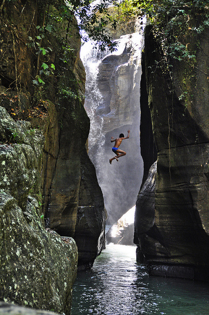 Jumping into the waters of Cunca Wulang Canyon, Flores, Indonesia